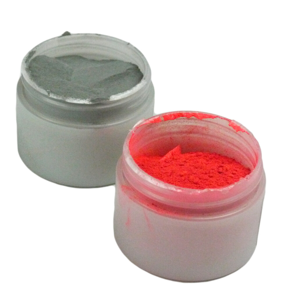 Two vials of fingerprint powder in different colors